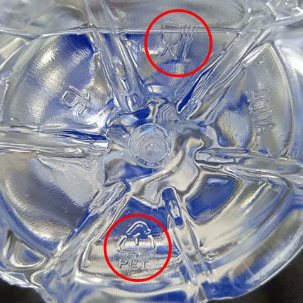 Food grade and recycling symbol on bottled water plastic
